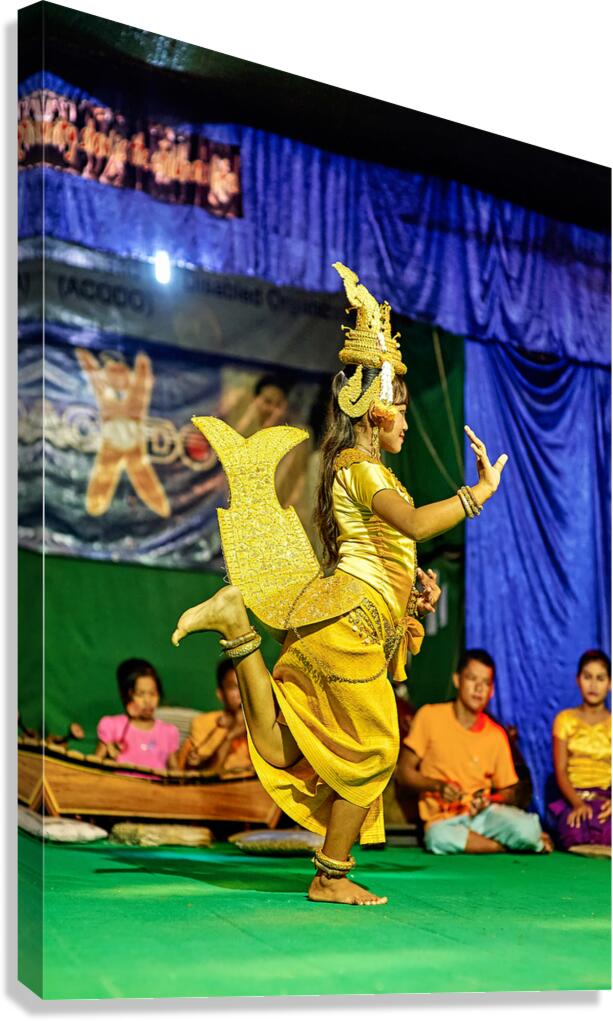 Girl performs traditional Cambodian dance in golden costume.