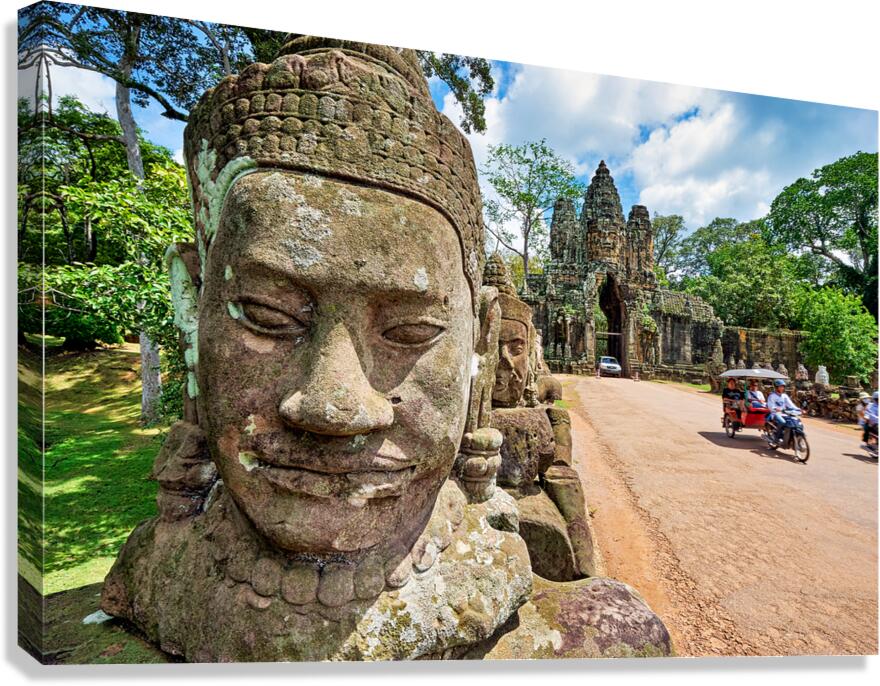 Ancient stone faces and grand temple gate at Angkor Thom.