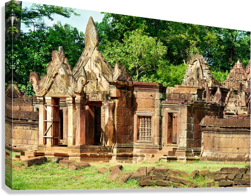 Ancient Banteay Srei temple ruins with intricate carvings and gr