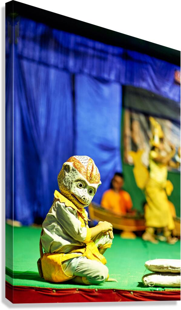 Traditional masked performer in monkey costume on stage.