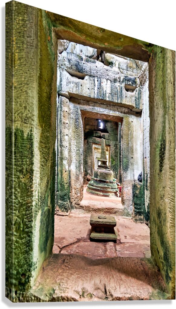 Weathered stone temple interior leading to a tiered stupa.
