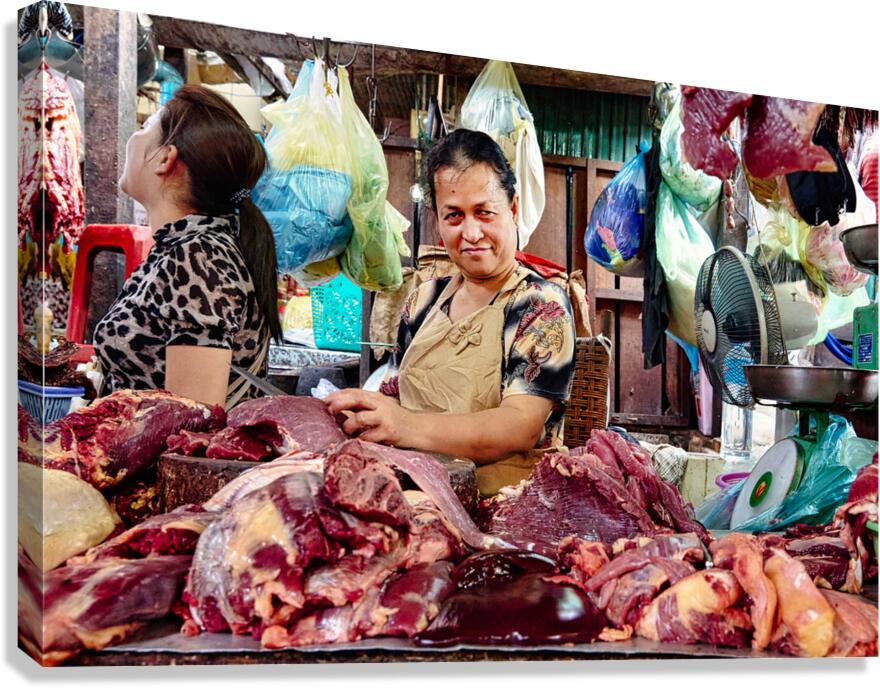 Market vendor with fresh meat display.