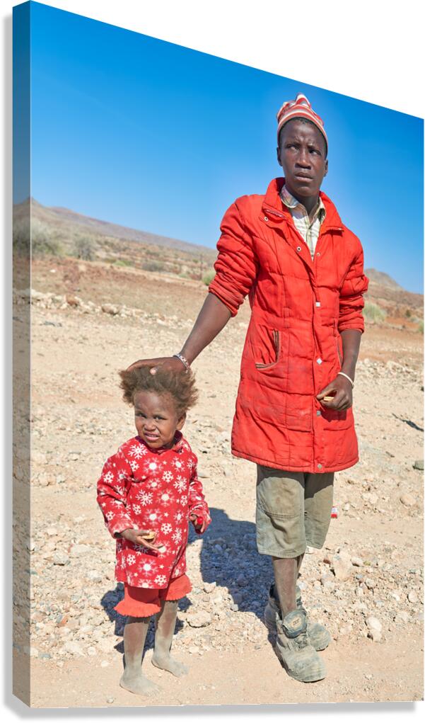 Father and daughter stand together in Palmwag Kunene Region