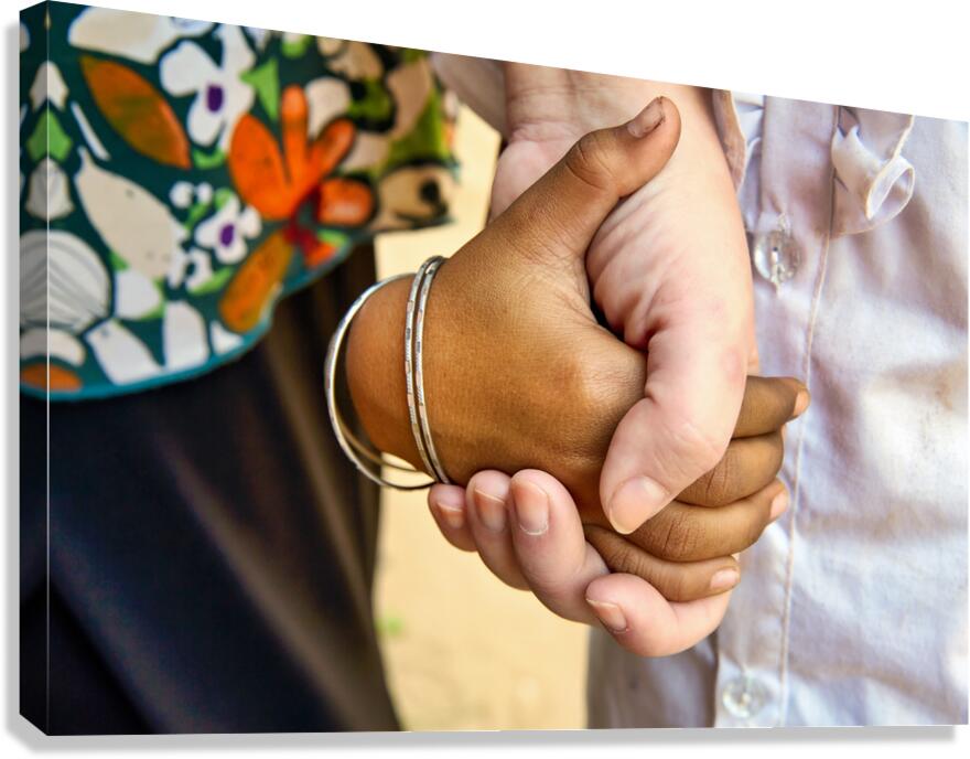 Diverse hands holding showing connection and support.