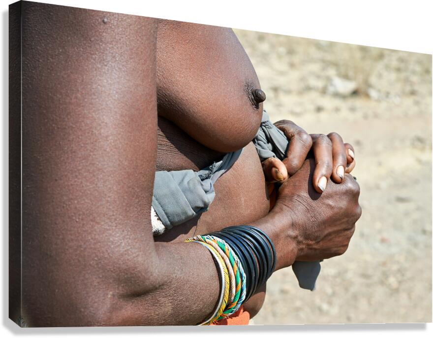 Detailed view of hands and chest of Zemba woman in Namibia