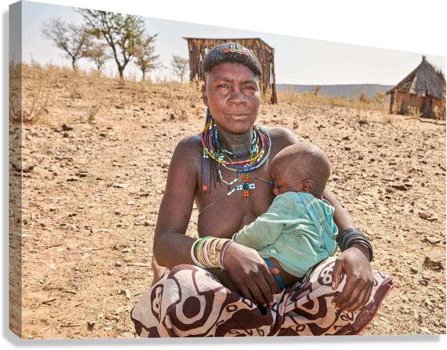 Young woman of Zemba Bantu ethnic group with child in Namibia