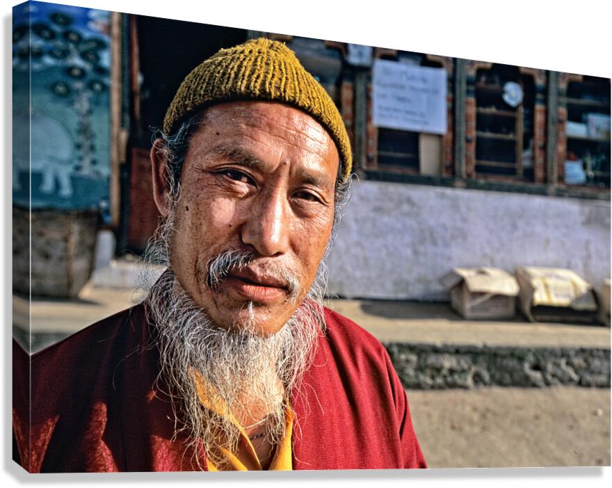 Portrait of a man with a long white beard and yellow beanie.
