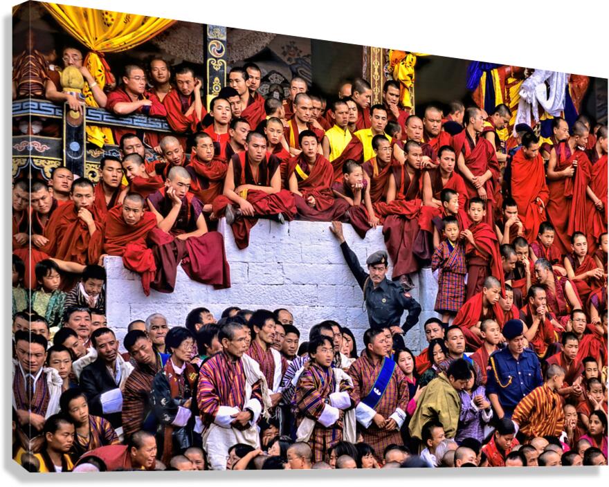 Monks and people observe a traditional Bhutanese ceremony.