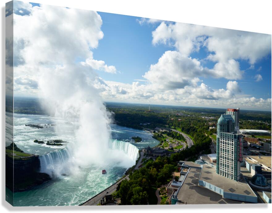 Panoramic view of Niagara Falls and urban landscape.