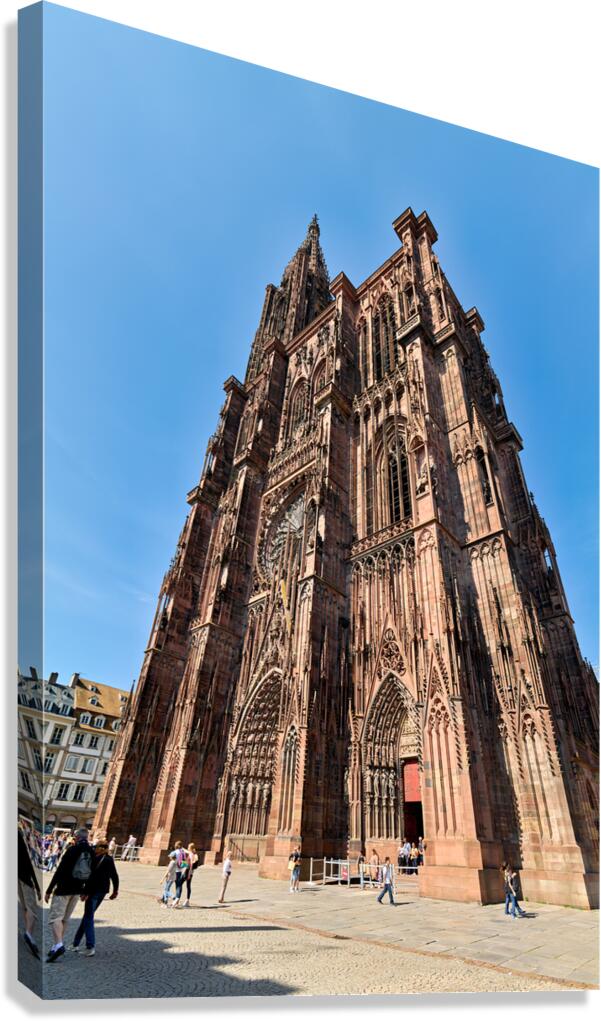 Strasbourg Cathedral stands tall in Alsace square on a sunny day