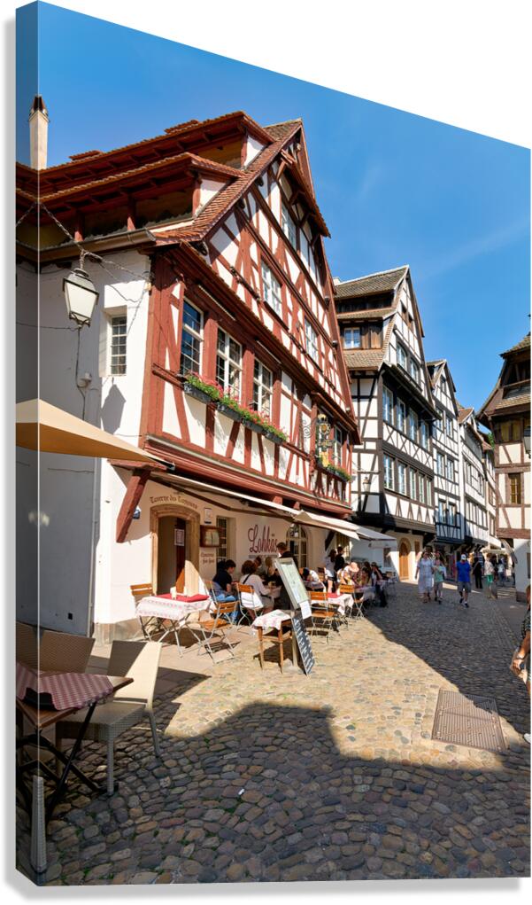 Colorful timber houses in Petit France with food loving visitors