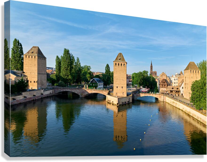Covered bridges connect towers over water in Strasbourg Alsace