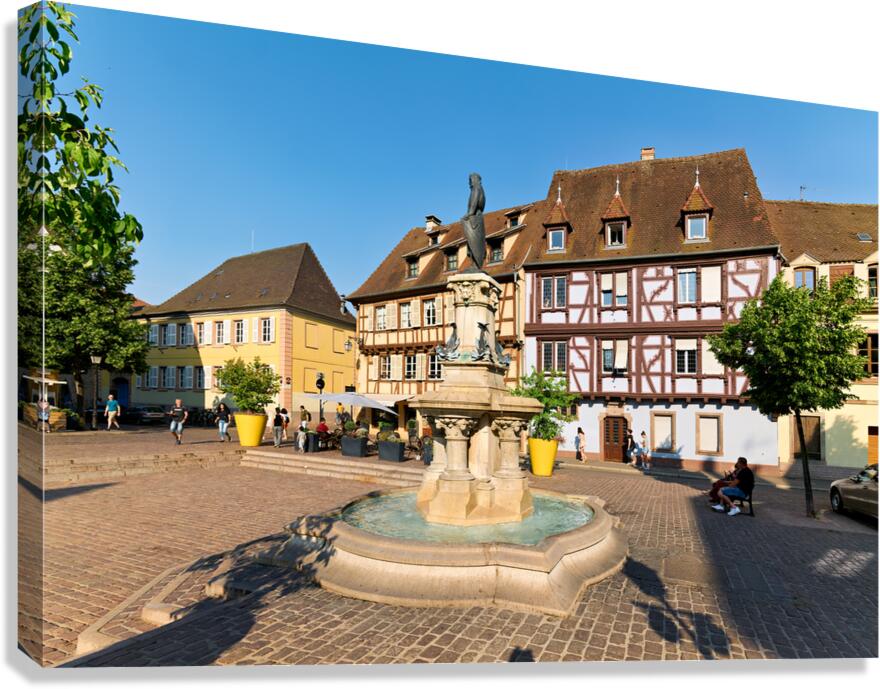 Visitors enjoy warm day at fountain in Petite Venise Colmar