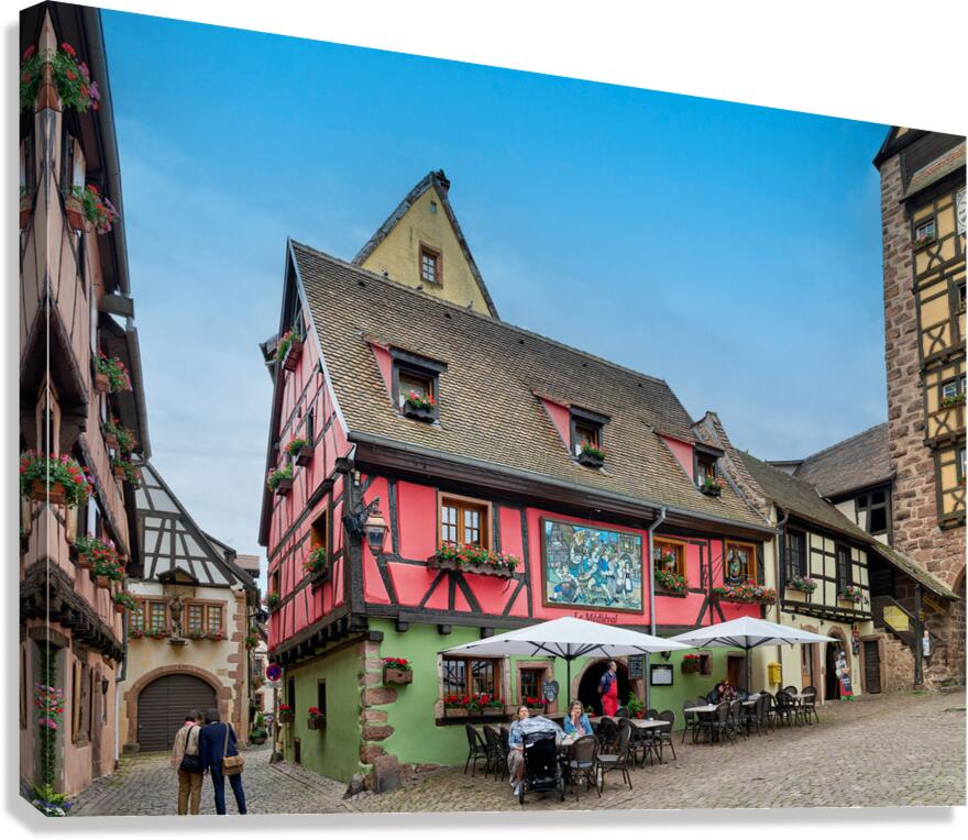Timber framed houses and outdoor dining in Riquewihr Alsace