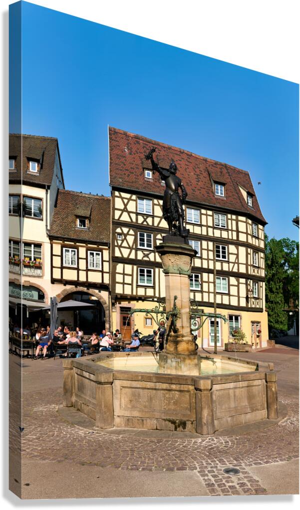Timber framed houses and fountain in old town of Colmar Alsace