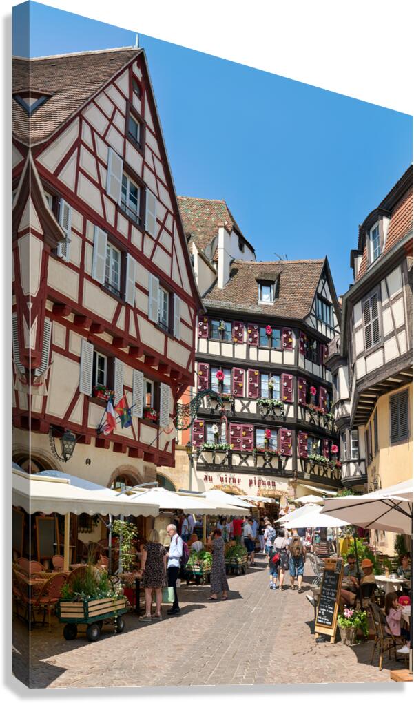 Timber framed houses in old town of Colmar with market stalls