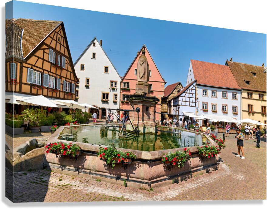 Visitors savor Saint Leon square in Eguisheim Alsace