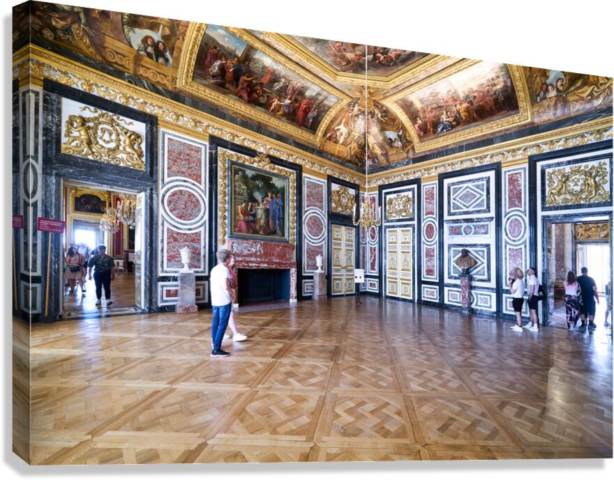 Visitors explore the grand rooms inside the Palace of Versailles
