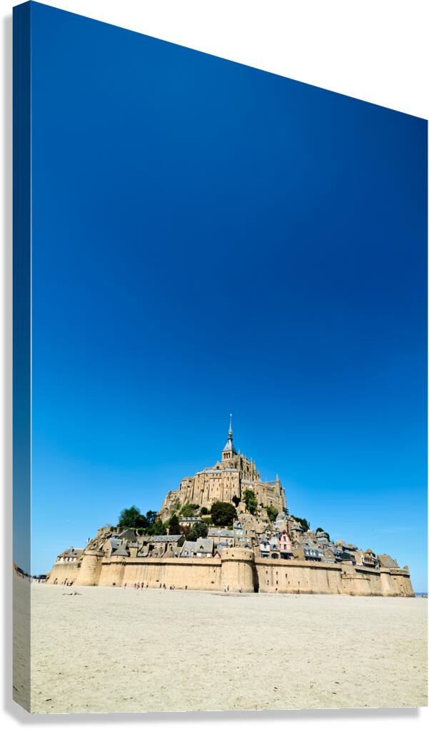 Mont Saint Michel at low tide in Normandy France with clear sky