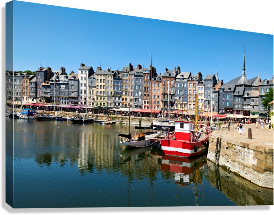 Harbour scene in Honfleur Normandy with boats and buildings