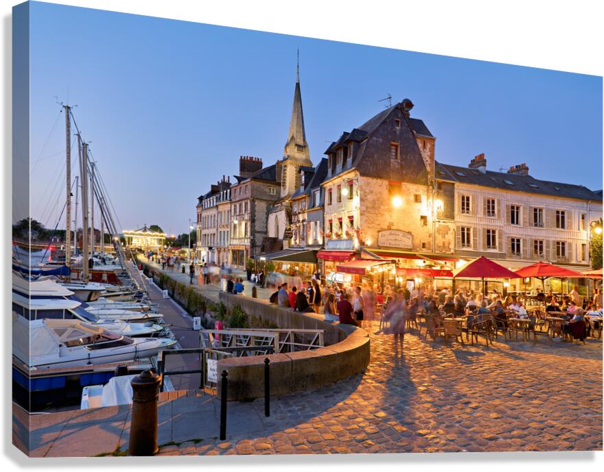 Harbour in Honfleur Normandy France during dusk with visible lig