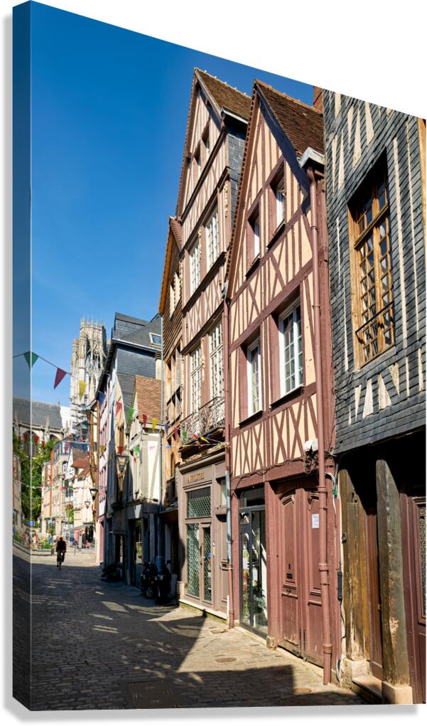 Timber houses line the street in Rouen Normandy France on a sunn