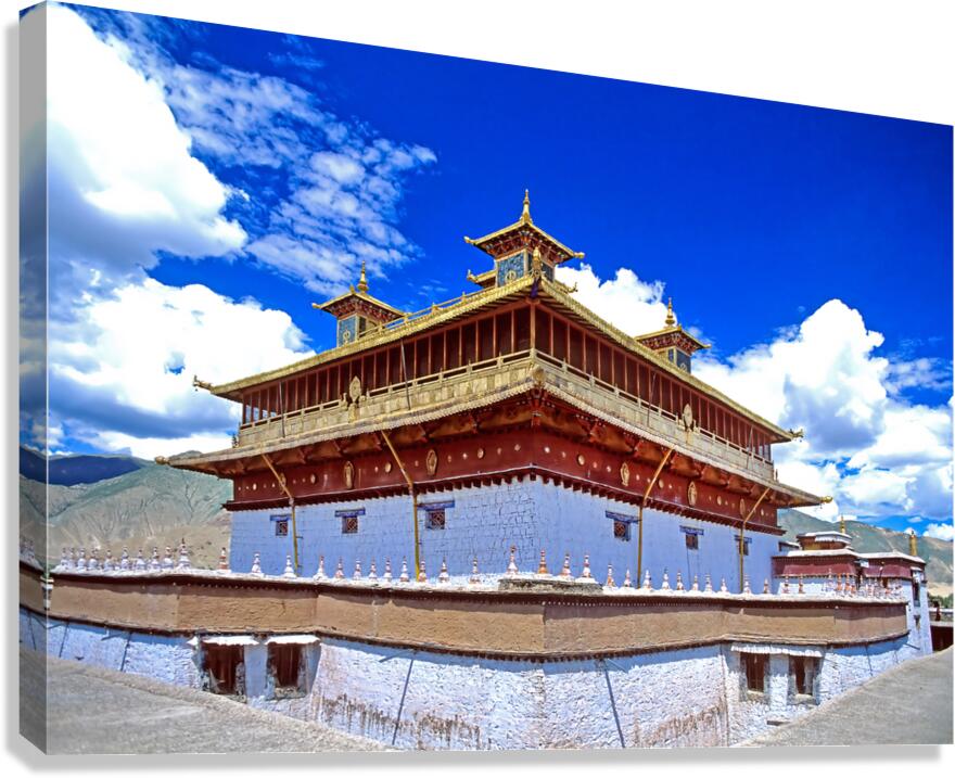 Golden roof of ancient Tibetan monastery under blue sky
