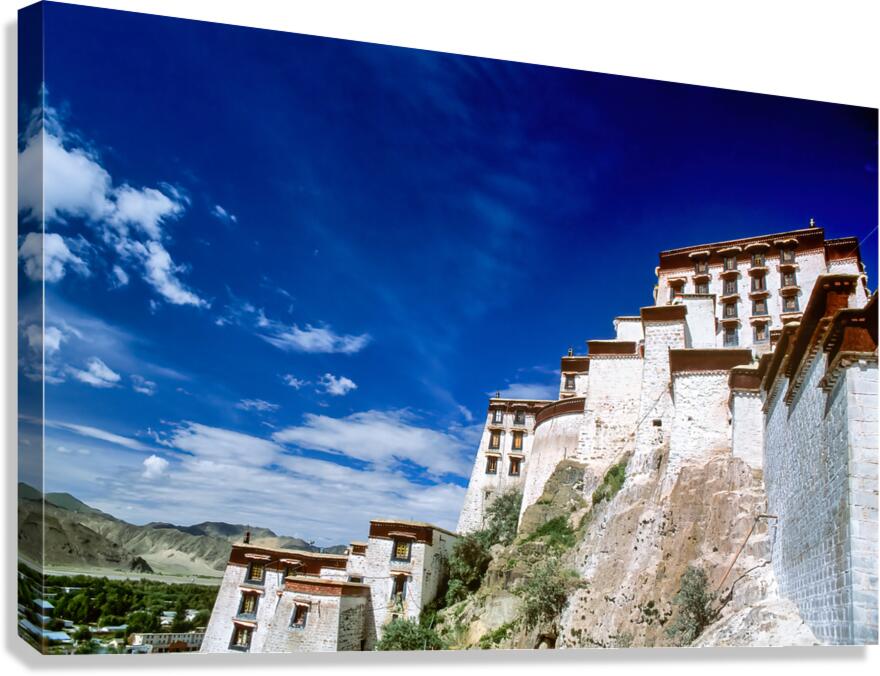 Majestic Potala Palace stands in Tibet under a bright blue sky