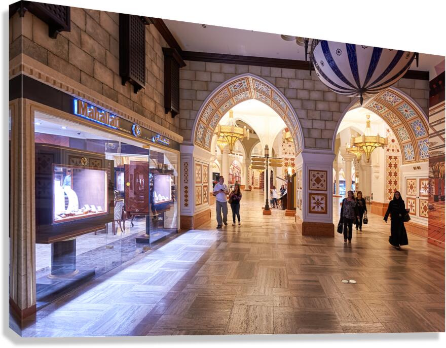 Shoppers explore stores in an Arabian themed mall in Dubai UAE