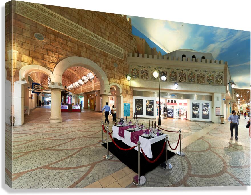 Indoor mall in Dubai features shops and a dining setup with peop