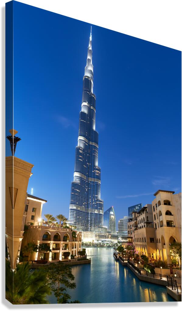 Burj Khalifa and Dubai canal light up night sky in Dubai UAE