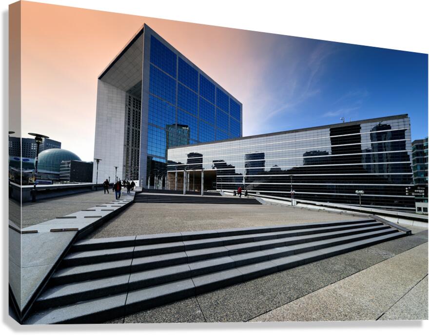 Visitors explore La Defense in Paris during a bright afternoon