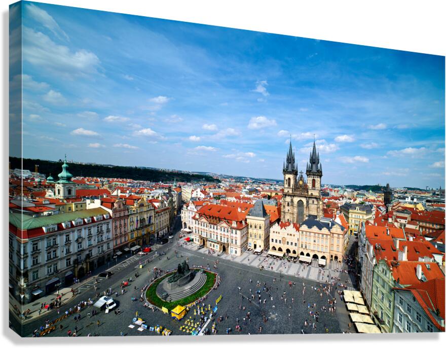 Aerial view of bustling Prague Old Town Square and Týn Church.