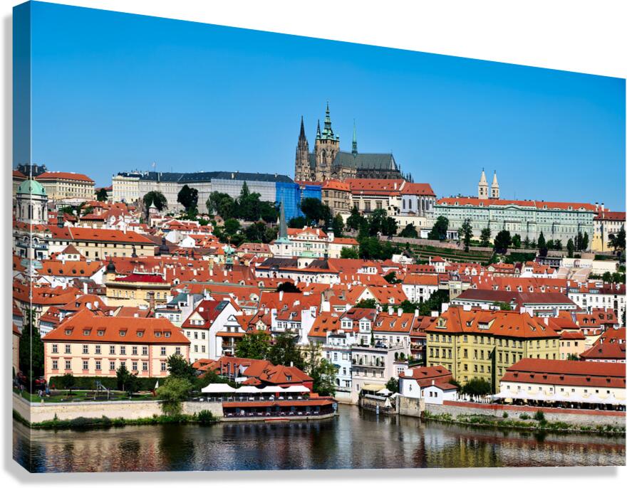 Prague Castle and city skyline over Vltava River.