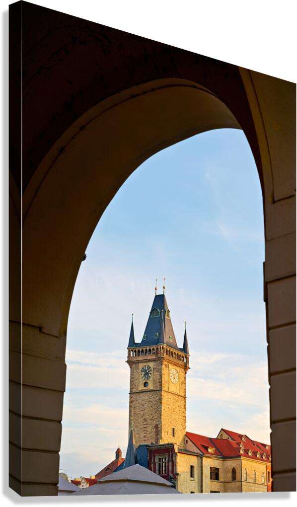 Historic clock tower framed by an archway.
