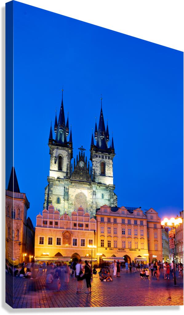 Pragues Tyn Church and Old Town Square at night.