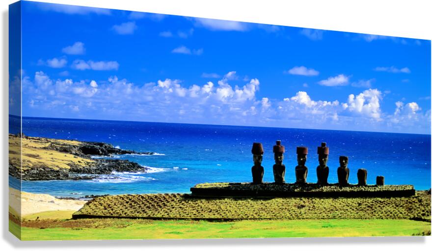 Easter Island Moai statues against a vibrant blue ocean and sky.