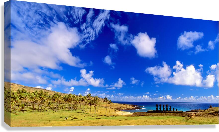Moai statues palm trees and beach on Easter Island.