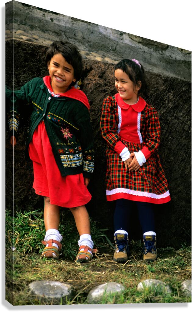 Two young girls smiling dressed in colorful outfits at Easter I
