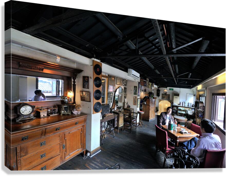 Customers enjoy drinks and food in a vintage cafe in Shanghai