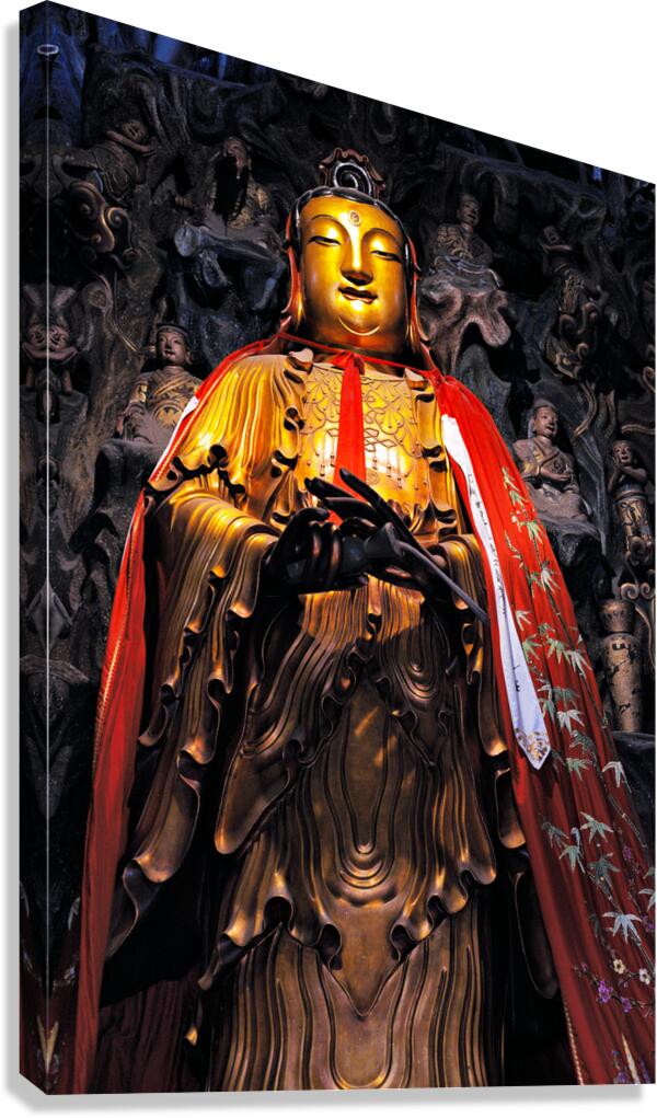 A golden Buddha statue stands in Shanghai wearing a red robe