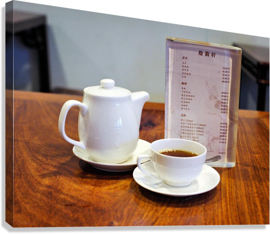 Enjoying tea and menu on a wooden table in Shanghai