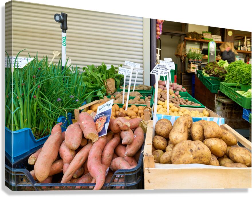 Greengrocer selling varieties of potatoes in Augsburg Bavaria