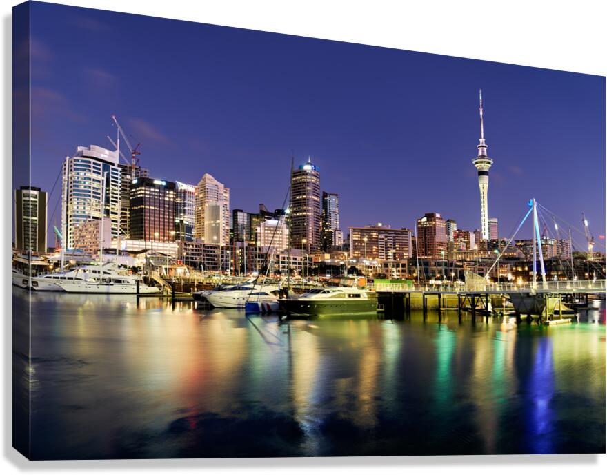 View of Auckland skyline from Viaduct Harbour at sunset