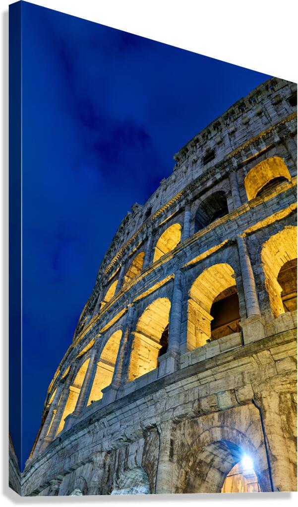 Colosseum in Rome at night with lights shining on the structure