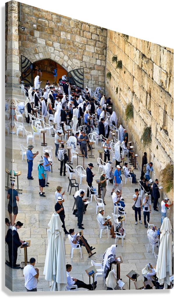 Visitors pray at the western wall in Jerusalem during the day