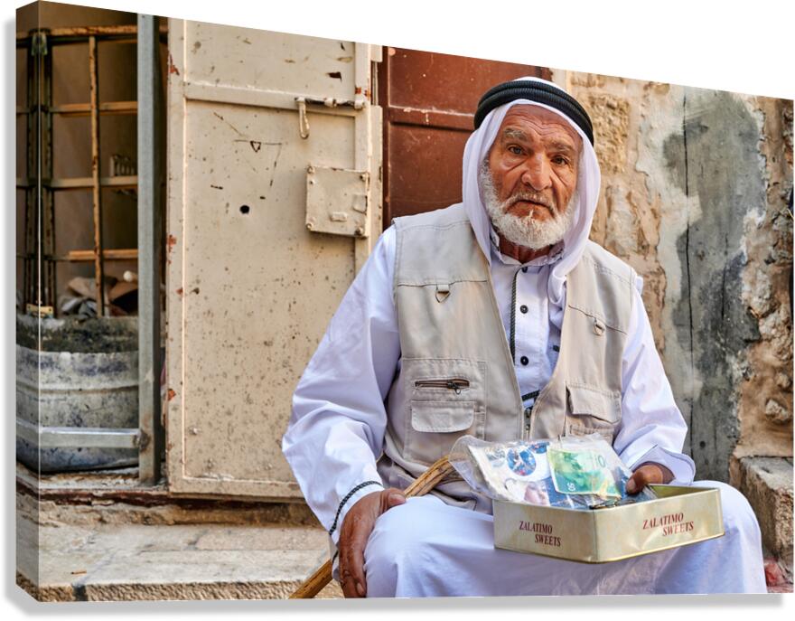 Old man sitting with sweets in Jerusalems old city