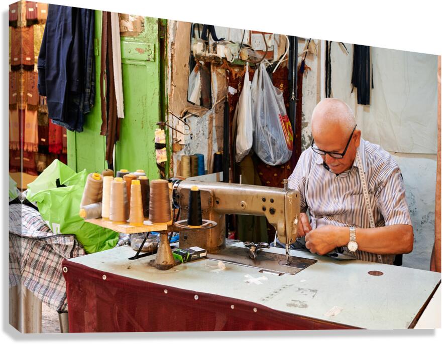 Tailor works in the Jewish quarter of Jerusalem Israel