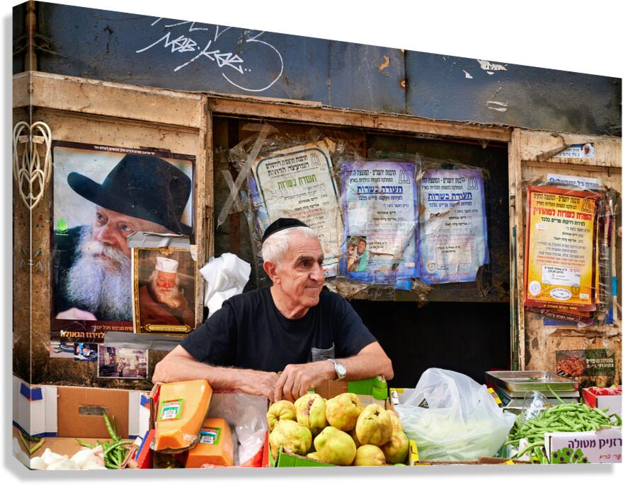 Man selling fruits in Mahane Yehuda Market in Jerusalem Israel