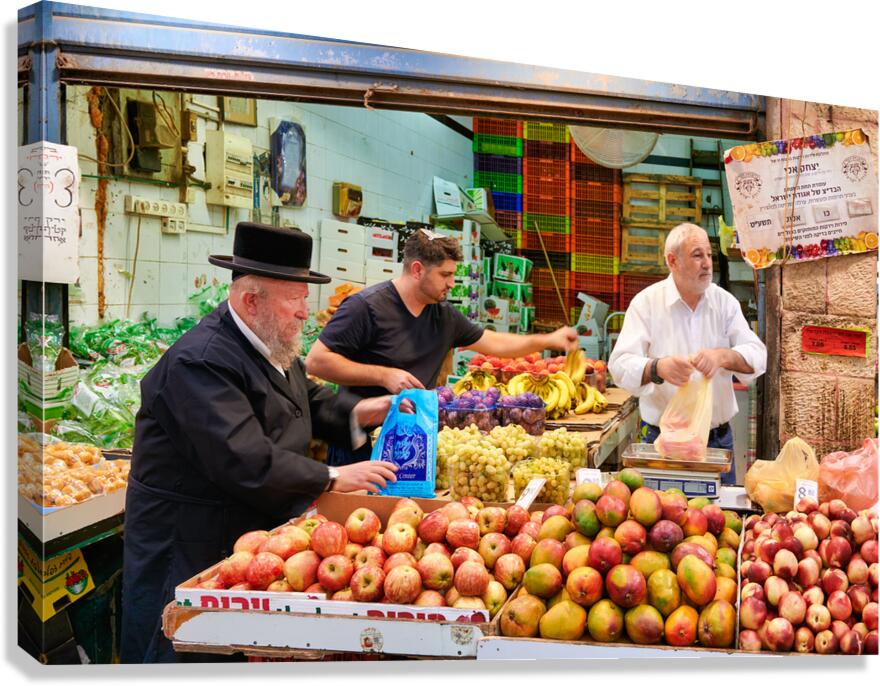 Vendors sell fresh produce at Mahane Yehuda Market in Jerusalem